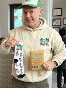 One of the most unique gifts I've received. Southern Conservation Trust former-Executive Director Katie Pace and Board Chair Brian Cooper gave me these socks and a plaque for my five years of services as Race Director of the Run the Ridge 5K in 2023. Photo/Mary Catherine Domaleski