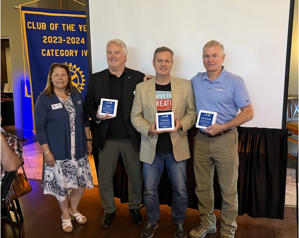 PTC Rotary Club President-elect Patti Kadkhodaian present the Rotary Business Leader of the Year Award to Pat Burke (Midwest Food Bank), Joe Domaleski (Country Fried Creative), and Brent Scarbrough (Brent Scarbrough & Company) on 5/16/24. Photo/Hollie Holder