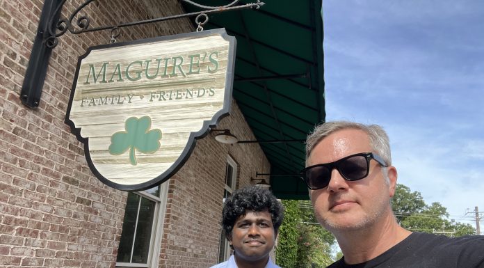 Country Fried Creative owner Joe Domaleski (right) with GSU Data Science Intern Vinay Revanuru in front of Maguire's Irish Pub, one of the subjects of their AI research. Photo/Joe Domaleski