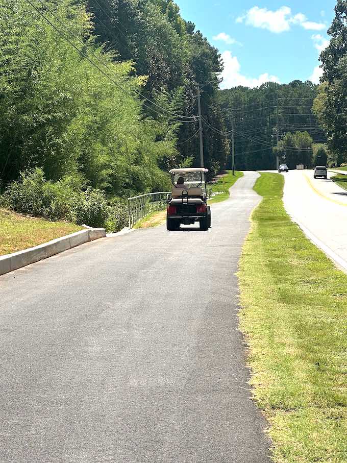 Cart path driver gets used to the extended Redwine Road path close to Starr's Mill school complex. Photo/Fayette County.