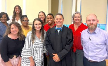 Fayette State Court Judge Jason Thompson (center in black robe) and the DUI Court team observe National Recovery Month during September. Photo/Submitted.