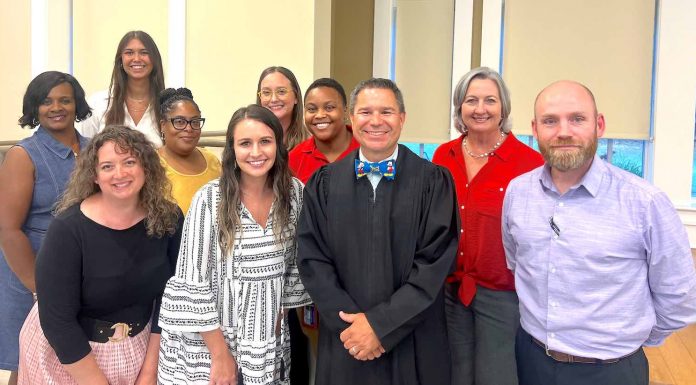 Fayette State Court Judge Jason Thompson (center in black robe) and the DUI Court team observe National Recovery Month during September. Photo/Submitted.