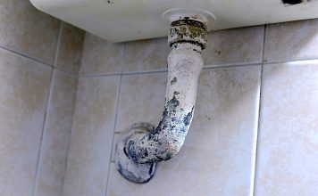 Lead pipe below a wash basin. Photo/Shutterstock.